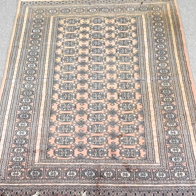 Lot 178 - A modern Bokhara rug, with three rows of...