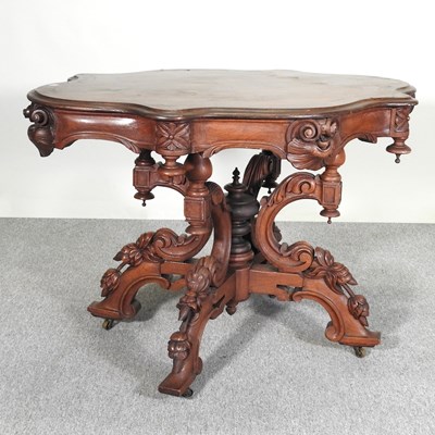 Lot 273 - An ornate Victorian style carved centre table,...