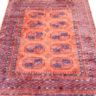 Lot 316 - An Afghan rug, with two rows of medallions, on...