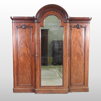 Lot 273 - A Victorian mahogany dome top triple wardrobe
