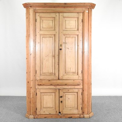 Lot 138 - An antique pine barrel back standing corner...