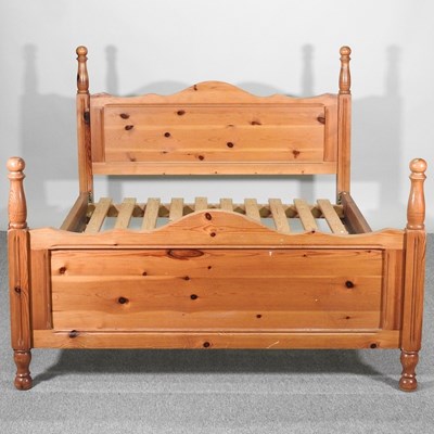 Lot 327 - A modern pine bedstead, with a slatted wooden...