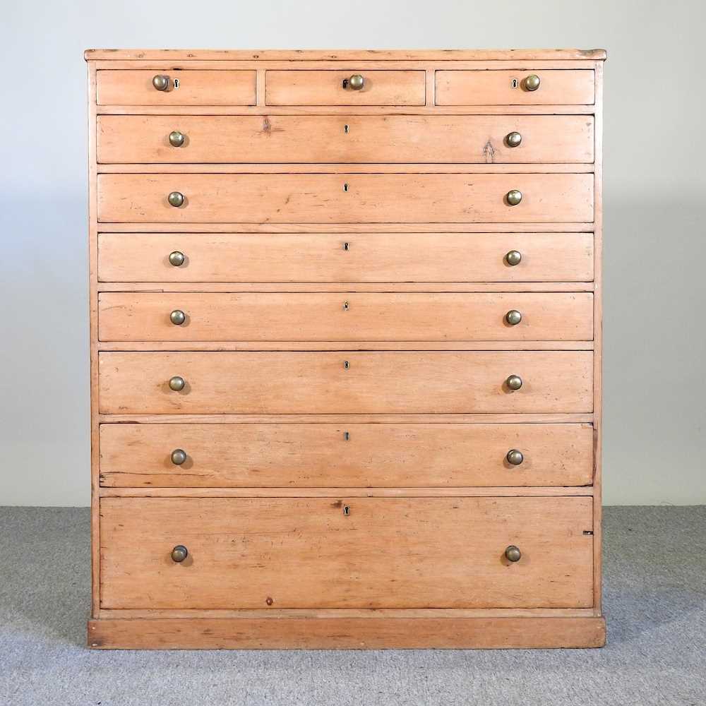 Lot 6 - An early 20th century pine chest, containing...