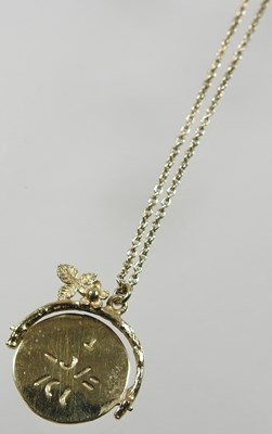 Lot 554 - A 9 carat gold bangle, with engraved...