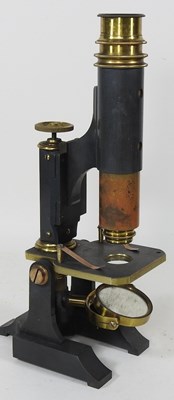 Lot 11 - An early 20th century microscope, 27cm high,...