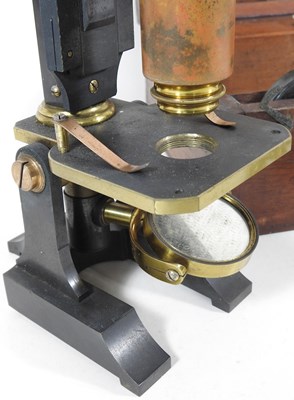 Lot 11 - An early 20th century microscope, 27cm high,...