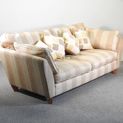 Lot 66 - A modern gold striped upholstered sofa, with...