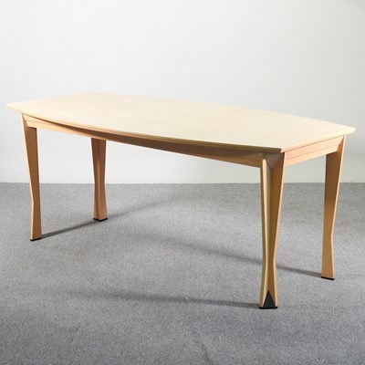 Lot 600 - A modern beech dining table, on shaped legs