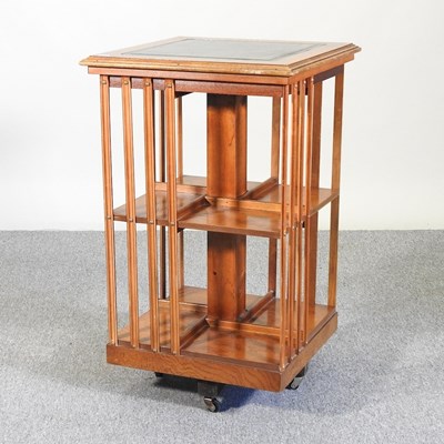 Lot 156 - A yew wood reproduction revolving bookcase