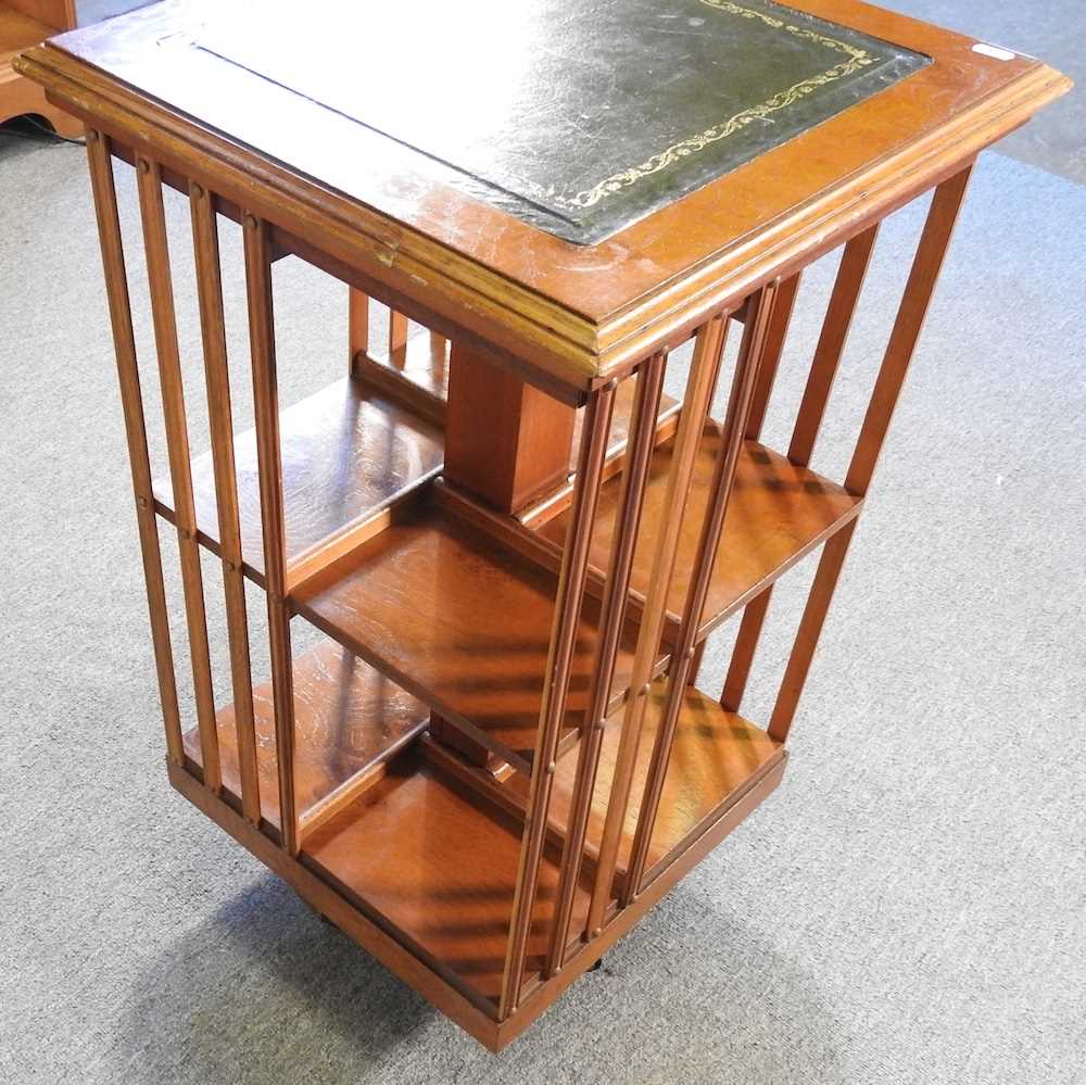 Lot 156 A yew wood reproduction revolving bookcase