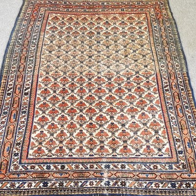 Lot 46 - A Persian carpet, with all over flowerhead...