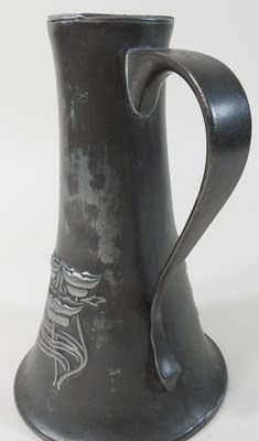 Lot 306 - A Tudric pewter jug