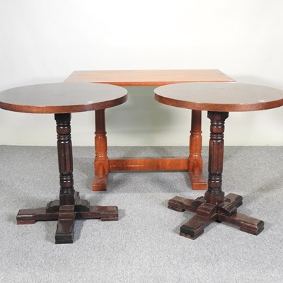 Lot 248 - A pair of circular oak pub tables, together...