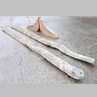 Lot 134 - A pair of rustic wooden structural beams, each...