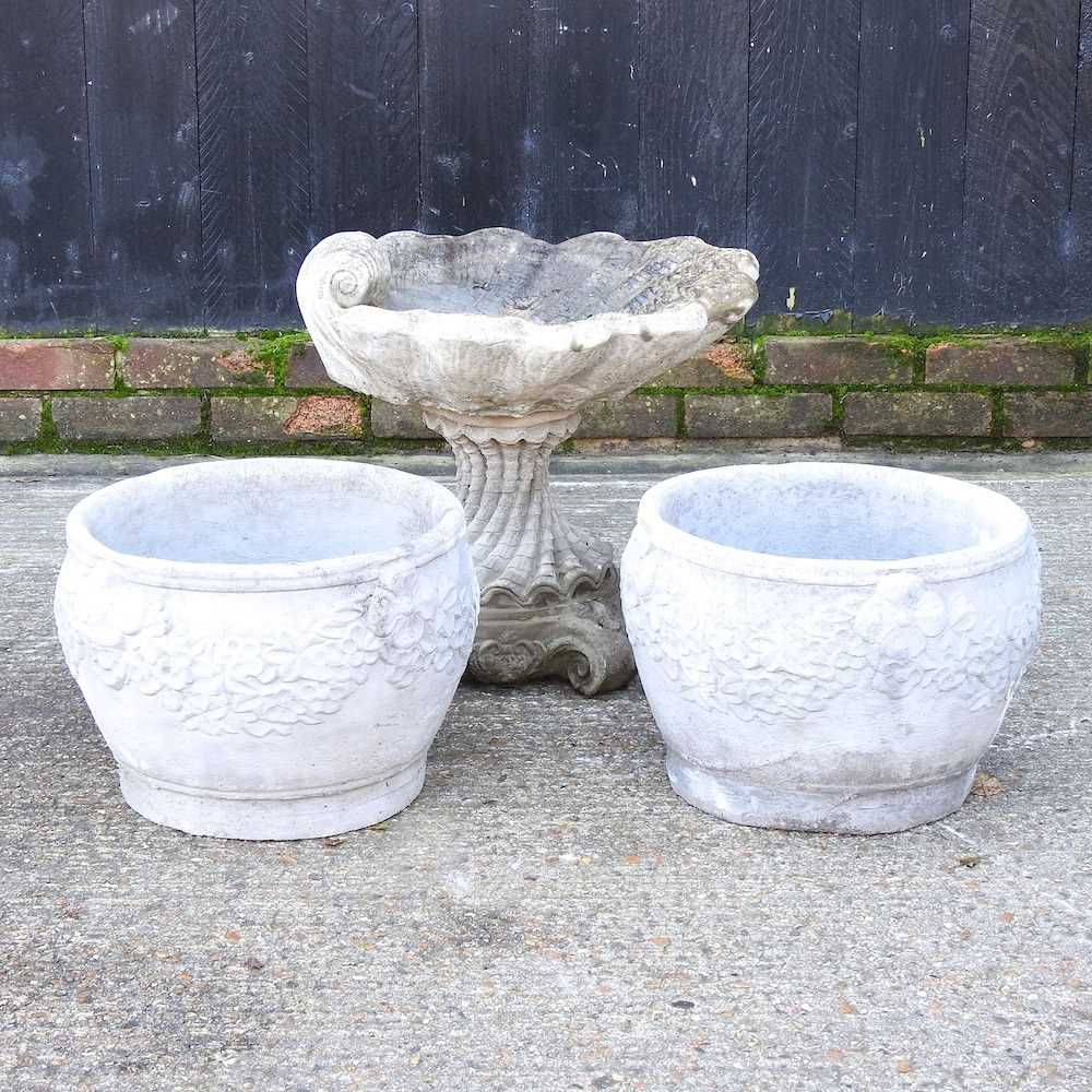 Lot 305 - A pair of reconstituted stone garden pots,...