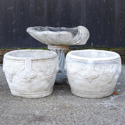 Lot 494 - A pair of reconstituted stone garden pots,...