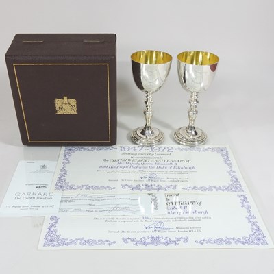 Lot 181 - A pair of Garrard silver wine goblets, to...