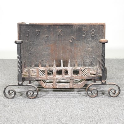 Lot 289 - A cast iron fire back, initialled FKS, dated...