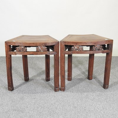 Lot 387 - A pair of Chinese carved hardwood side tables,...