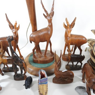 Lot 69 - A collection of African hardwood carvings and...