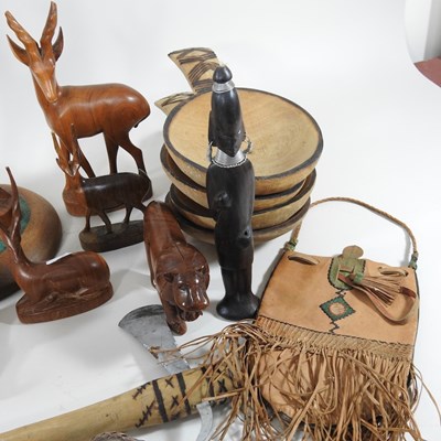 Lot 69 - A collection of African hardwood carvings and...