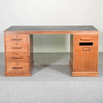 Lot 214 - A mid century pedestal desk, with an inset...