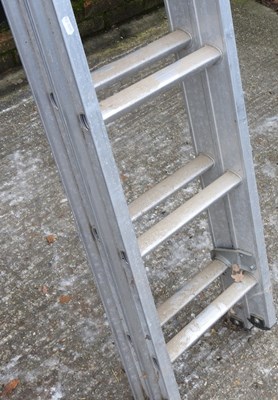 Lot 96 - An aluminium extending ladder, in two sections,...