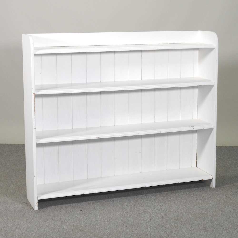 Lot 246 A white painted pine dwarf open bookcase
