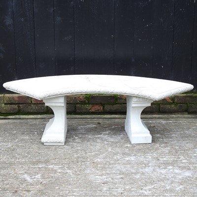 Lot 279 - A cast stone garden bench with a curved seat