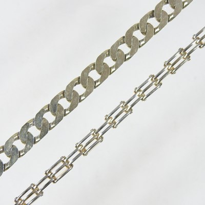 Lot 345 - A heavy 9 carat gold curb link bracelet, with...