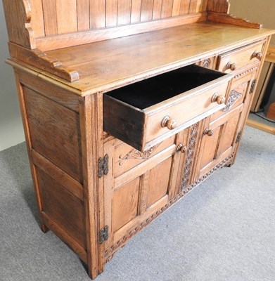 Lot 271 - A mid 20th century carved oak dresser, with a...