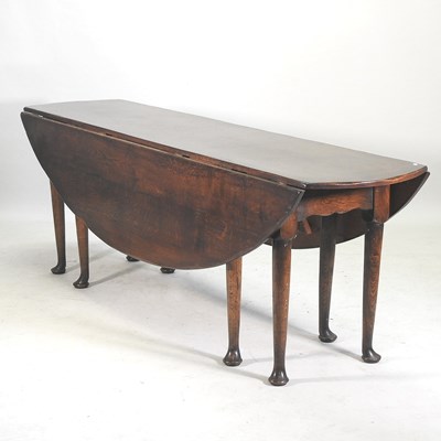 Lot 527 - A George III style oak wakes table