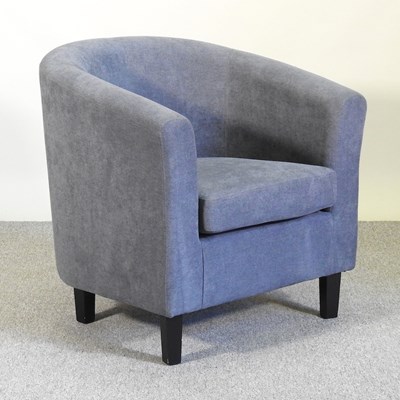 Lot 494 - A modern grey upholstered tub shaped armchair