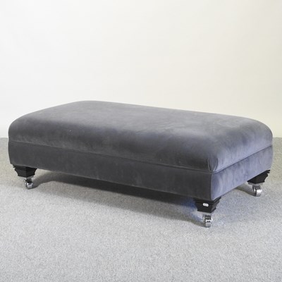 Lot 476 - A modern grey upholstered footstool, on casters