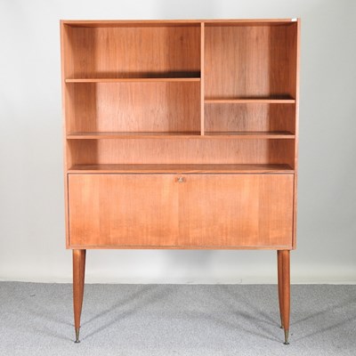 Lot 616 - A 1970's teak secretaire bookcase