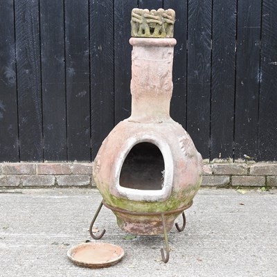 Lot 614 - A chiminea, on a metal stand, 112cm high