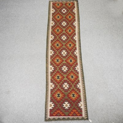 Lot 282 - A kelim runner