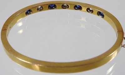 Lot 56 - An early 20th century 18 carat gold sapphire...