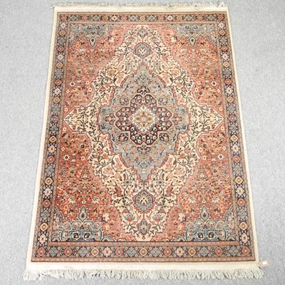 Lot 550 - A Persian carpet, with a central medallion and...