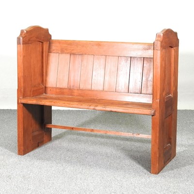 Lot 259 - A 19th century pine church pew, with a boarded...