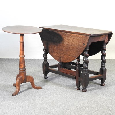 Lot 596 - An 18th century oak gateleg dining table,...