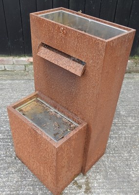 Lot 302 - A rusted metal garden water feature