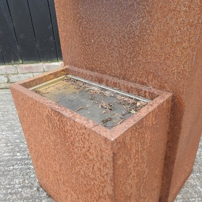 Lot 302 - A rusted metal garden water feature