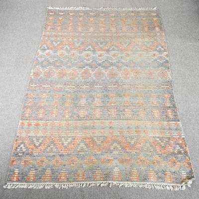 Lot 399 - A woollen carpet, with all over geometric...