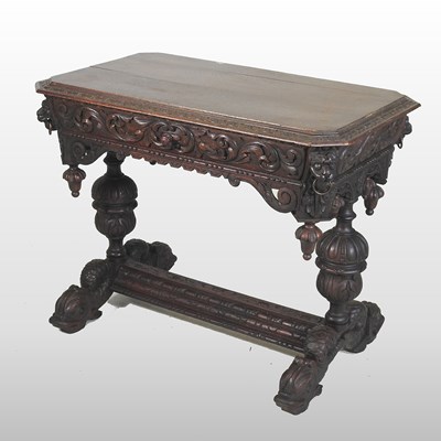 Lot 620 - A 19th century heavily carved dark oak centre table