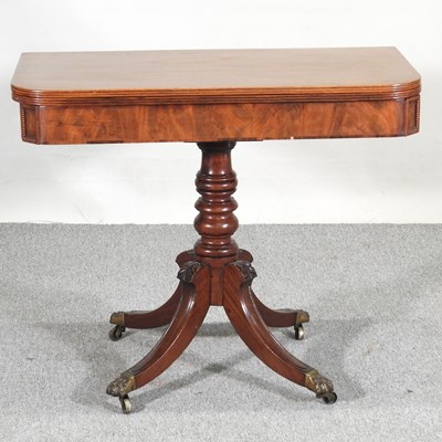 Lot 422 - A Regency mahogany folding tea table, on a...