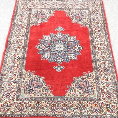 Lot 227 - A Persian rug, with a large central medallion,...