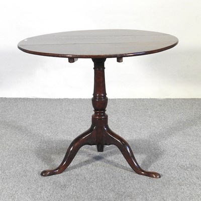 Lot 373 - A George III oak occasional table, with a...