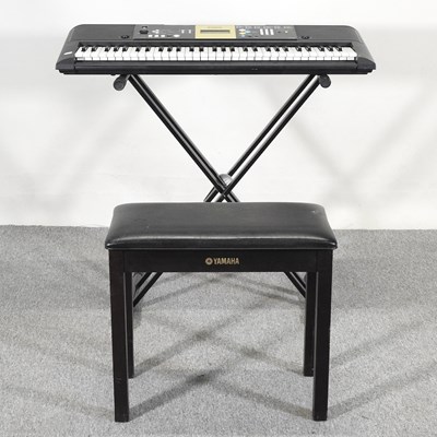 Lot 453 - A Yamaha electric keyboard, 94cm wide, on...