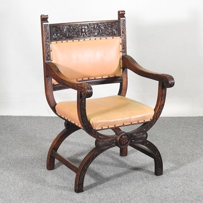 Lot 279 - An early 20th century carved oak open armchair,...